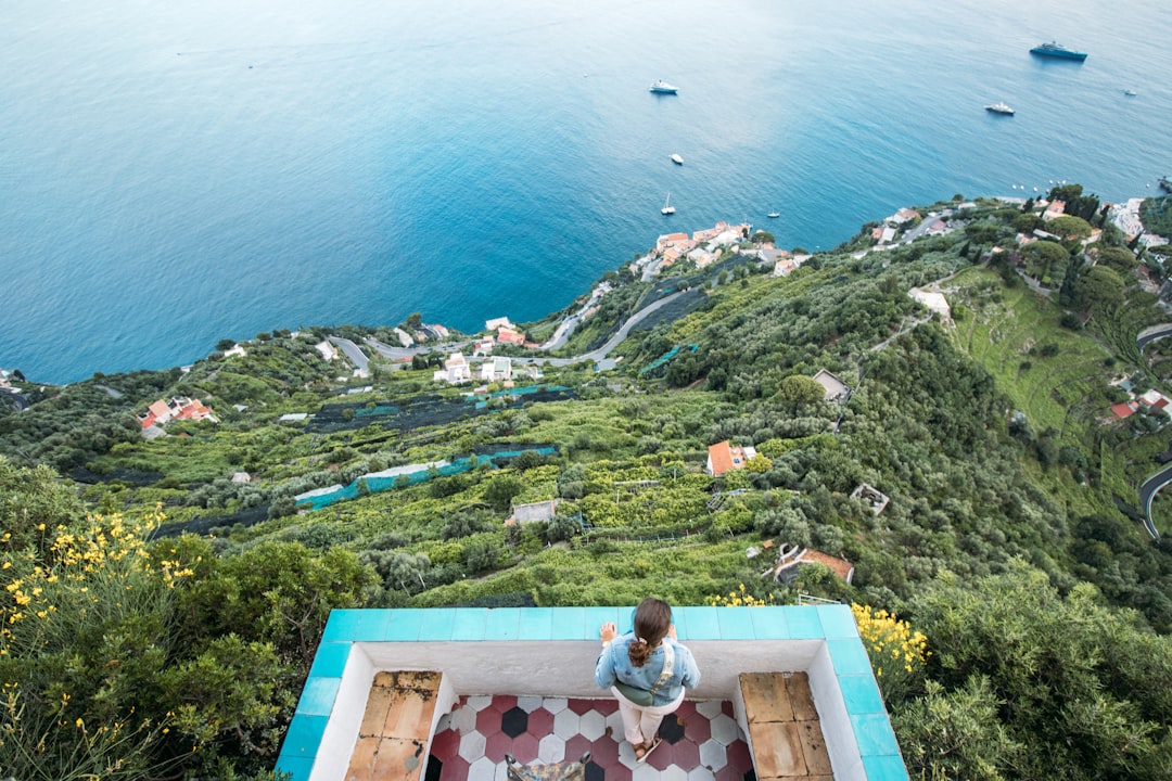 Couple enjoying wine on terrace overlooking the Amalfi Coast