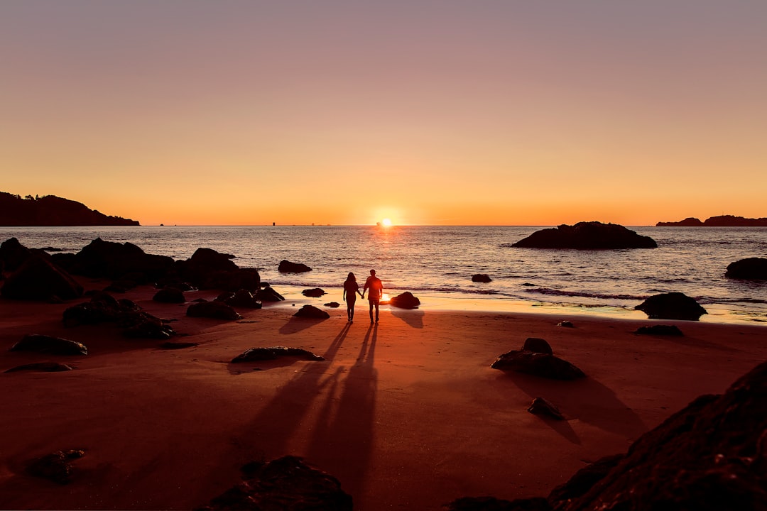 Couple enjoying sunset on a beach vacation