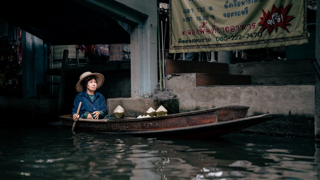 Family exploring vibrant floating market in Thailand